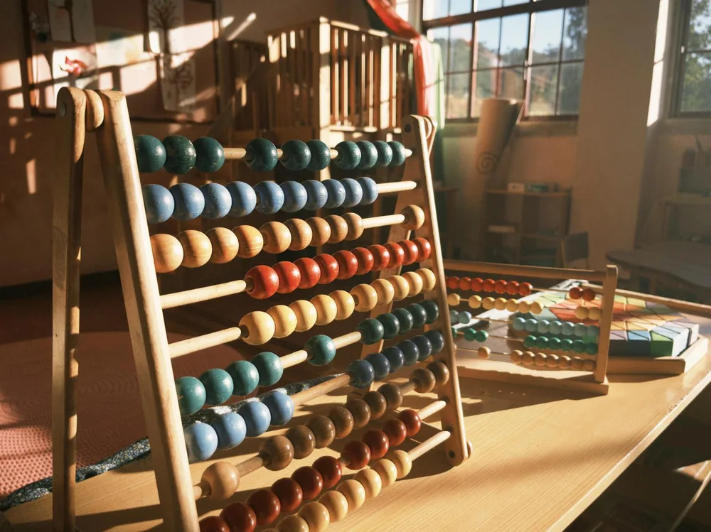 A wooden abacus in the afternoon sunlight